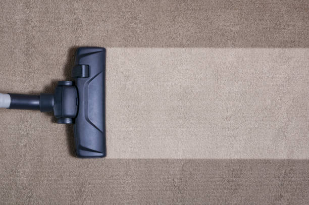 Vacuum cleaner on the floor showing house cleaning concept