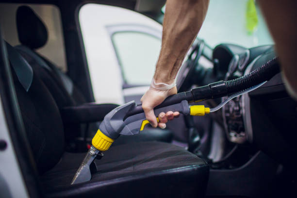 Car interior textile seats chemical cleaning with professionally extraction method. Early spring cleaning or regular clean up